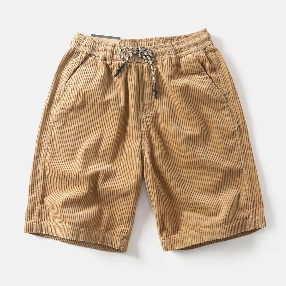 Man wearing khaki retro-style polyester cargo shorts with a straight leg fit for summer.