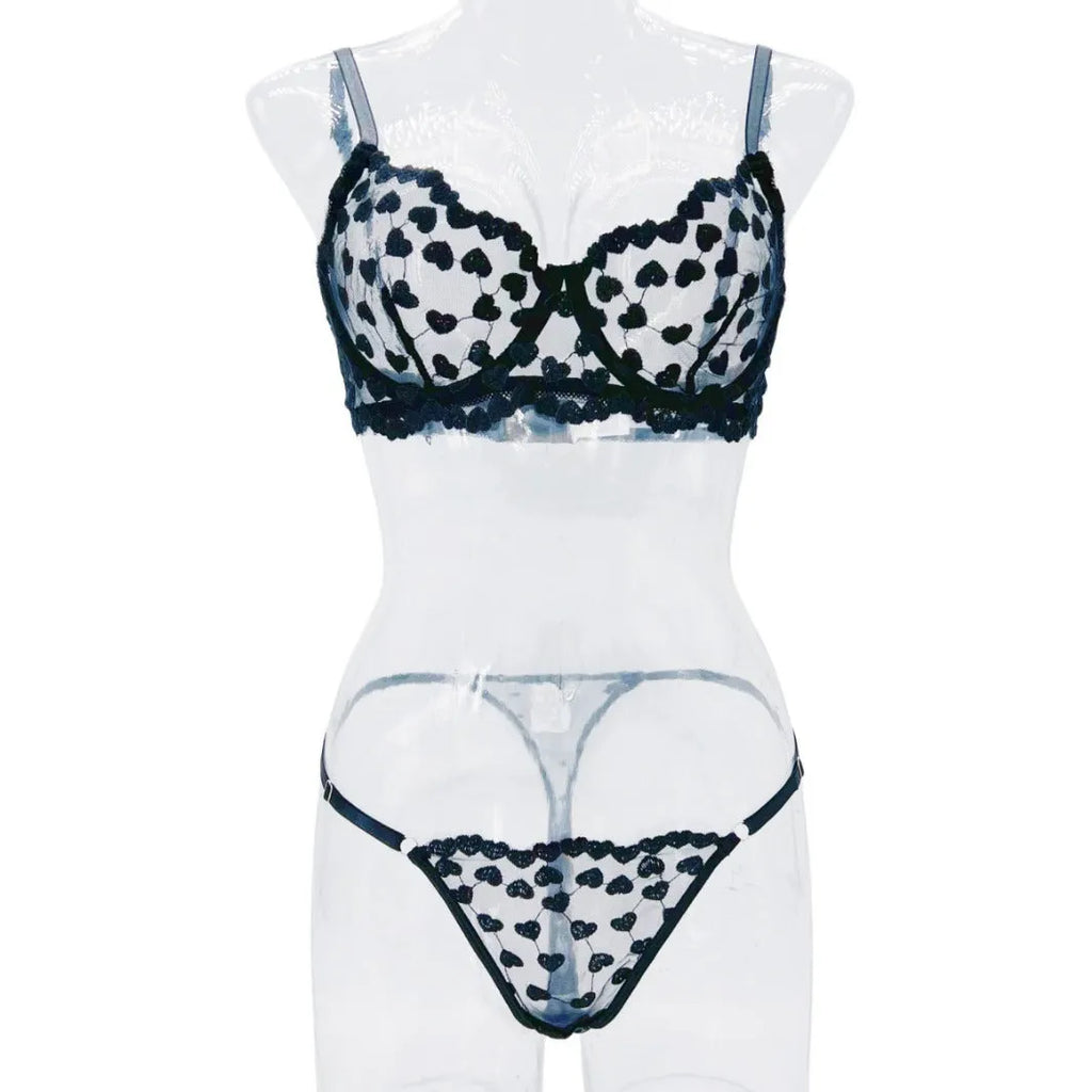 Women's two-piece mesh suit with romantic multi-colour overlay design, showing sleeveless top and matching trousers