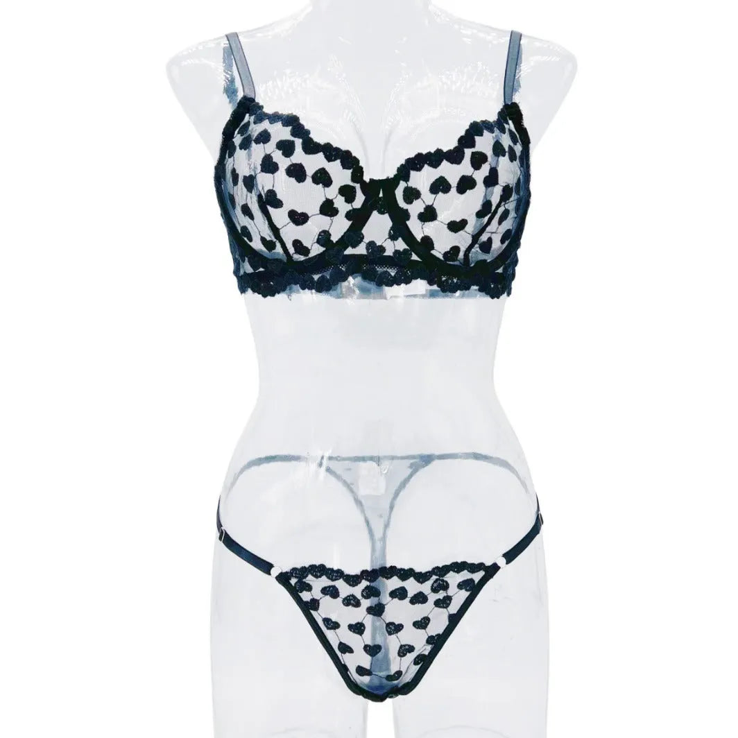 Women's two-piece mesh suit with romantic multi-colour overlay design, showing sleeveless top and matching trousers
