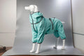 Cotton-padded dog shell jacket in four colours: red, black, light blue, and grey, shown on a model dog