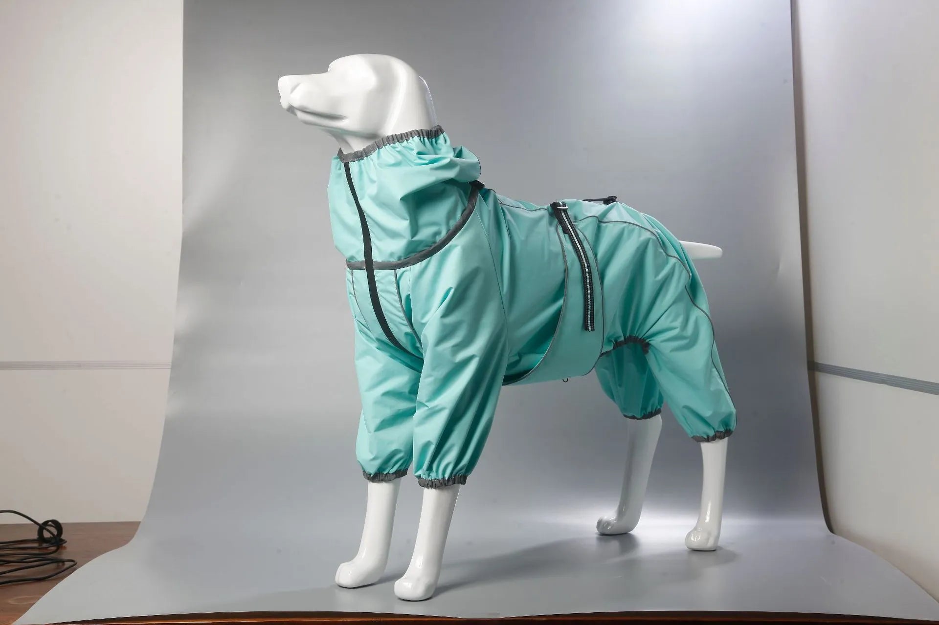 Cotton-padded dog shell jacket in four colours: red, black, light blue, and grey, shown on a model dog