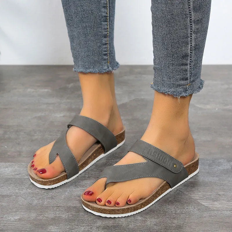 Women's blue flat toe ring thick-soled flip-flops with artificial PU upper on a plain background