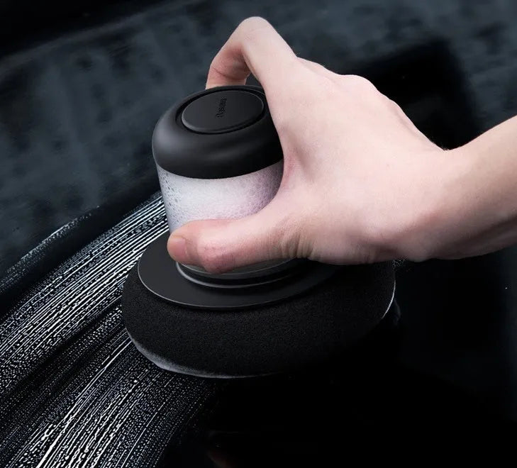 Dual-action car polishing machine with 6 speed settings in black ABS PC body with sponge pad attached