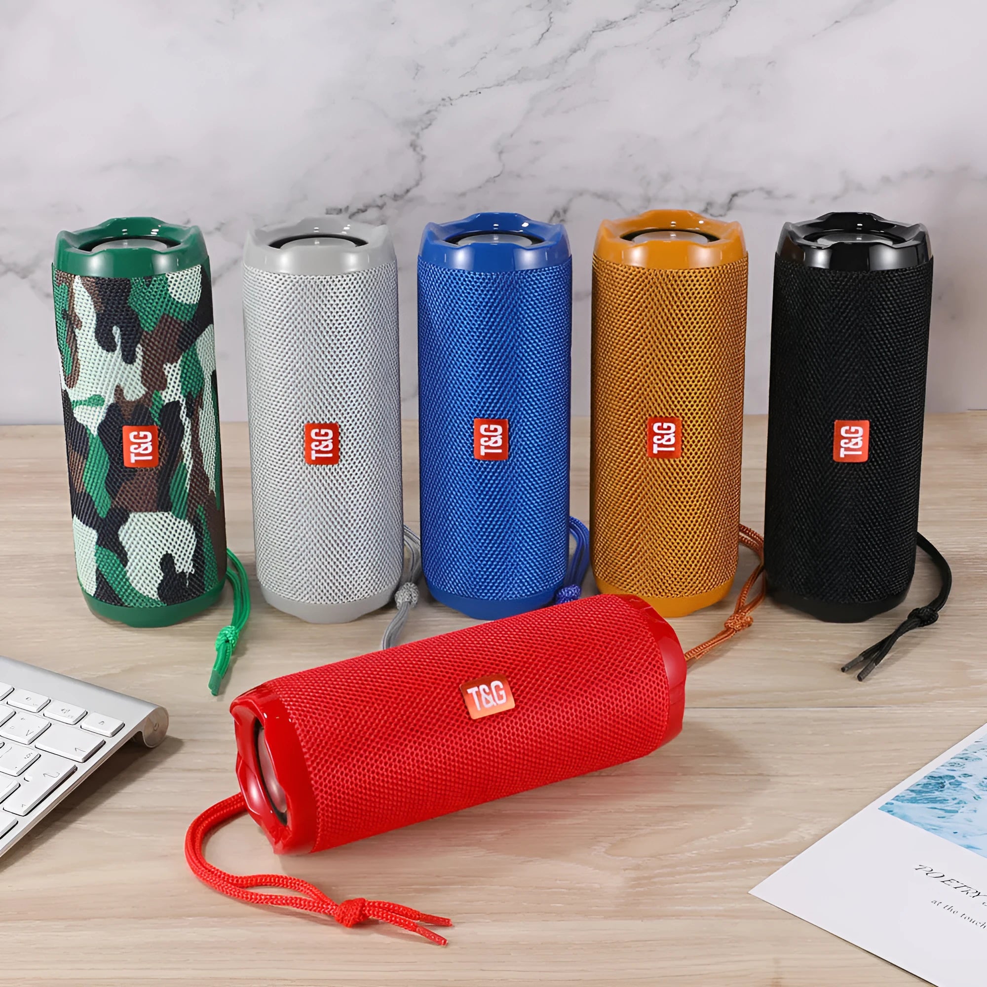 Fabric portable Bluetooth speaker in a choice of colours showing the integrated card holder slot.