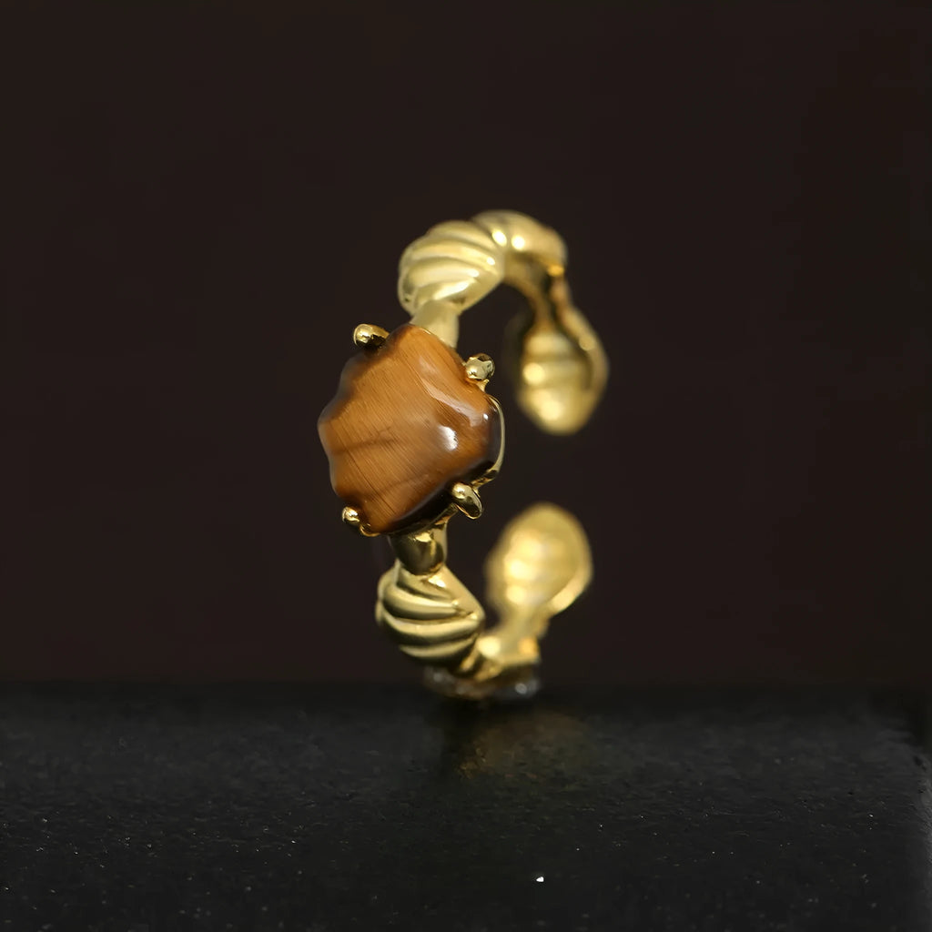 Women's adjustable silver ring with a shell tiger eye stone and white gold electroplating.
