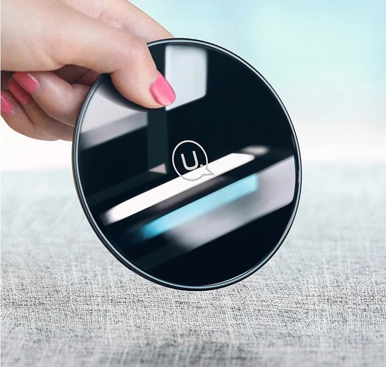 Glass disc wireless charger showing black and white colour options with charging indicator