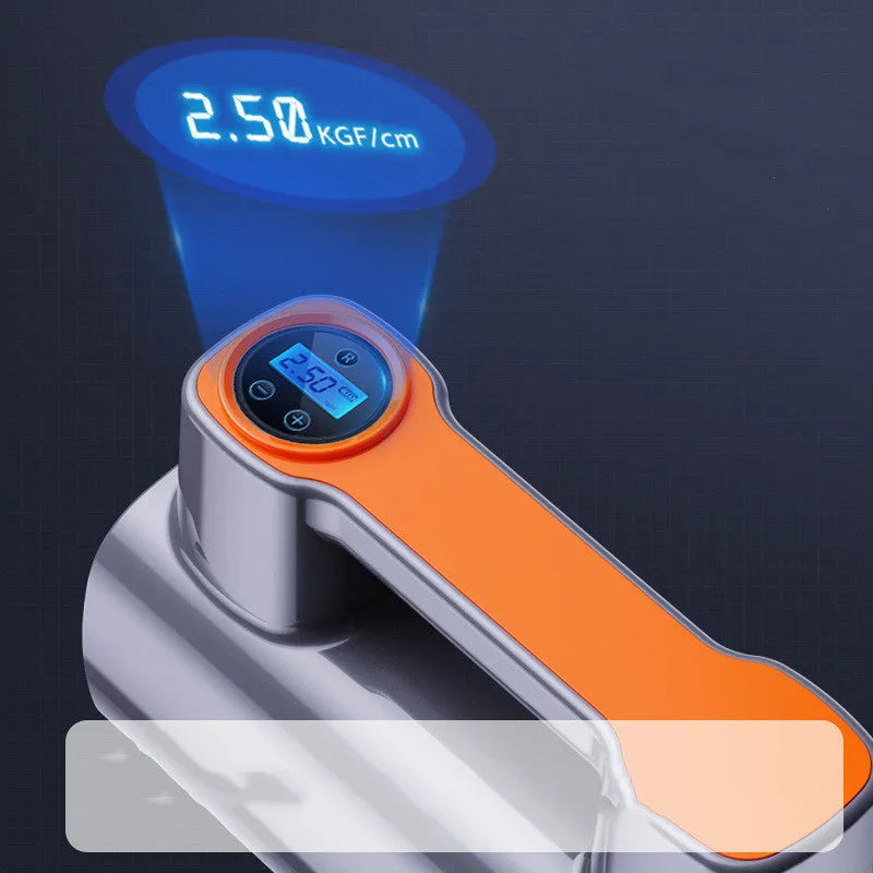 Black portable wireless tire inflator with digital display and USB charging cable on a grey background.
