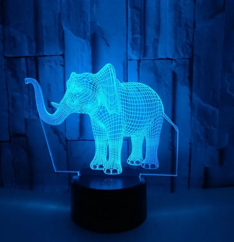3D LED elephant touch lamp showing seven colour modes on a wooden desk