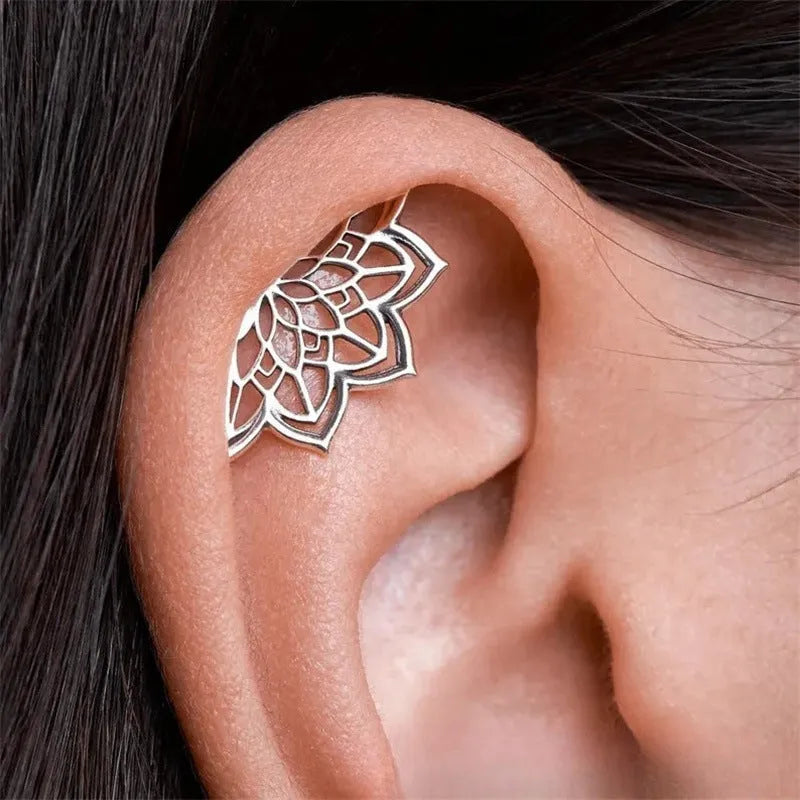Geometric spider web stud earrings with electroplated gold finish and mesh patterning