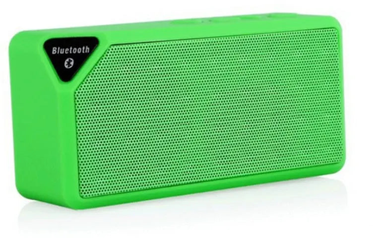 Small cube-shaped Cannon X3 portable Bluetooth speaker in multiple colour options on a table.