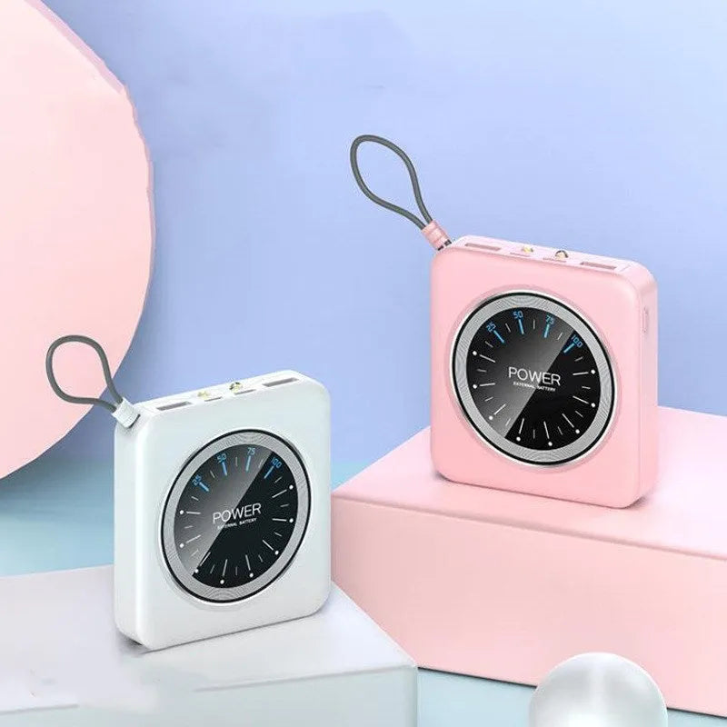 Mini clock charger in alloy case showing multi-U ports, displayed next to a coin for scale