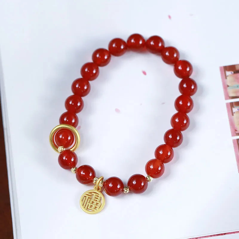 Natural red agate bracelet with hand-woven cord in national style, shown with blessing card.