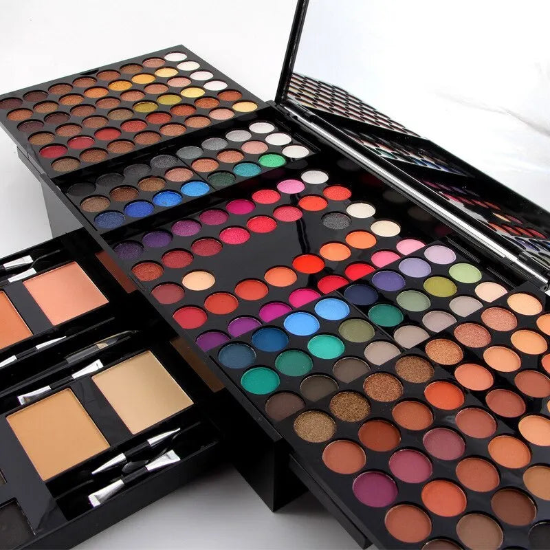 Piano-shaped makeup palette open to show 180 eyeshadow colours with powder and blush pans