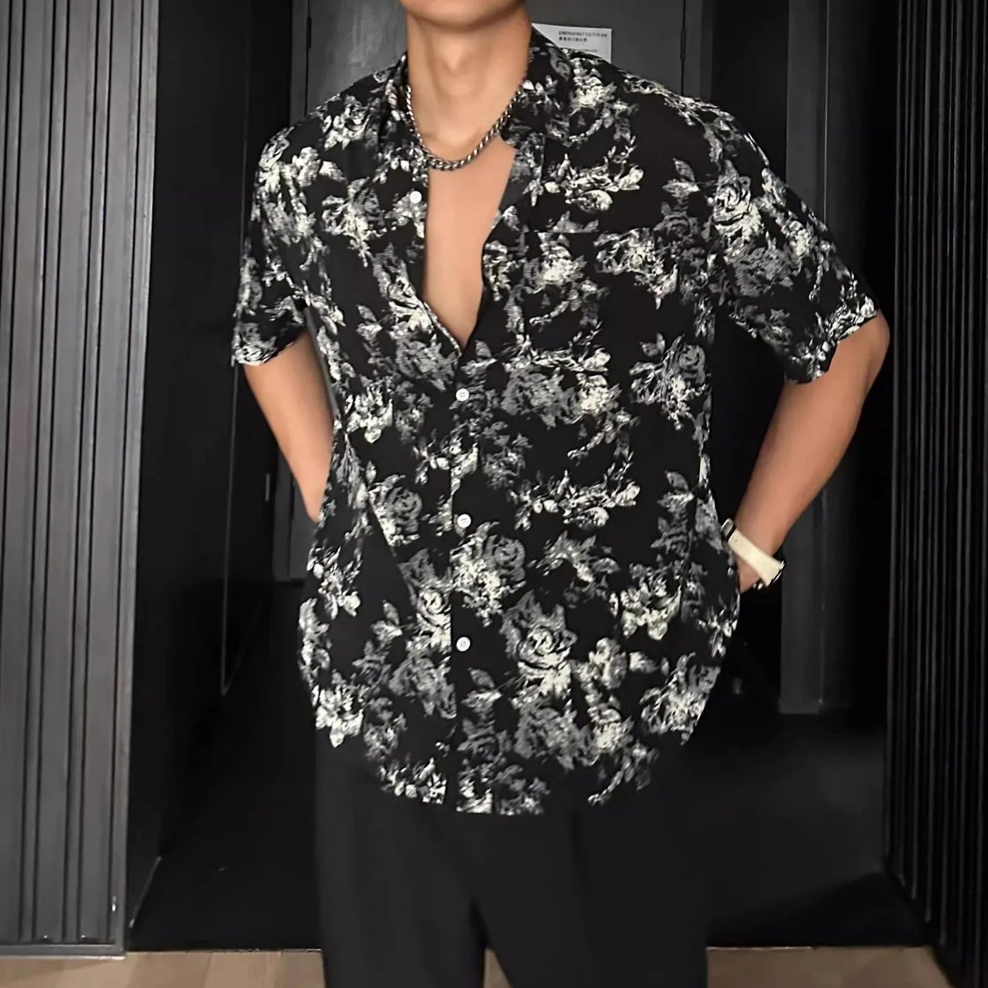 Women's loose casual short-sleeve shirt with a floral print pattern in white or black.