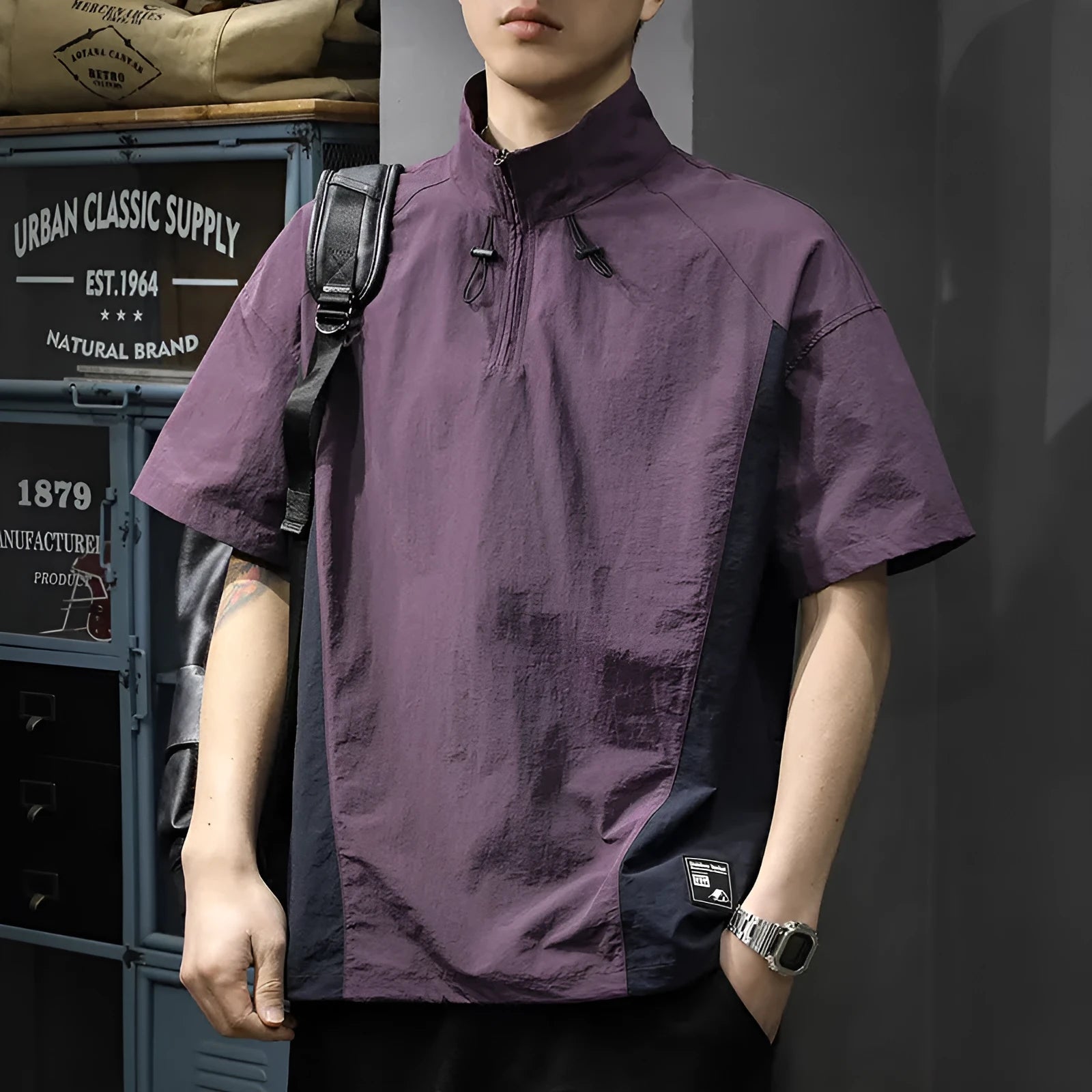 Man wearing a brown half-zip stand collar casual shirt made from ice silk fabric.