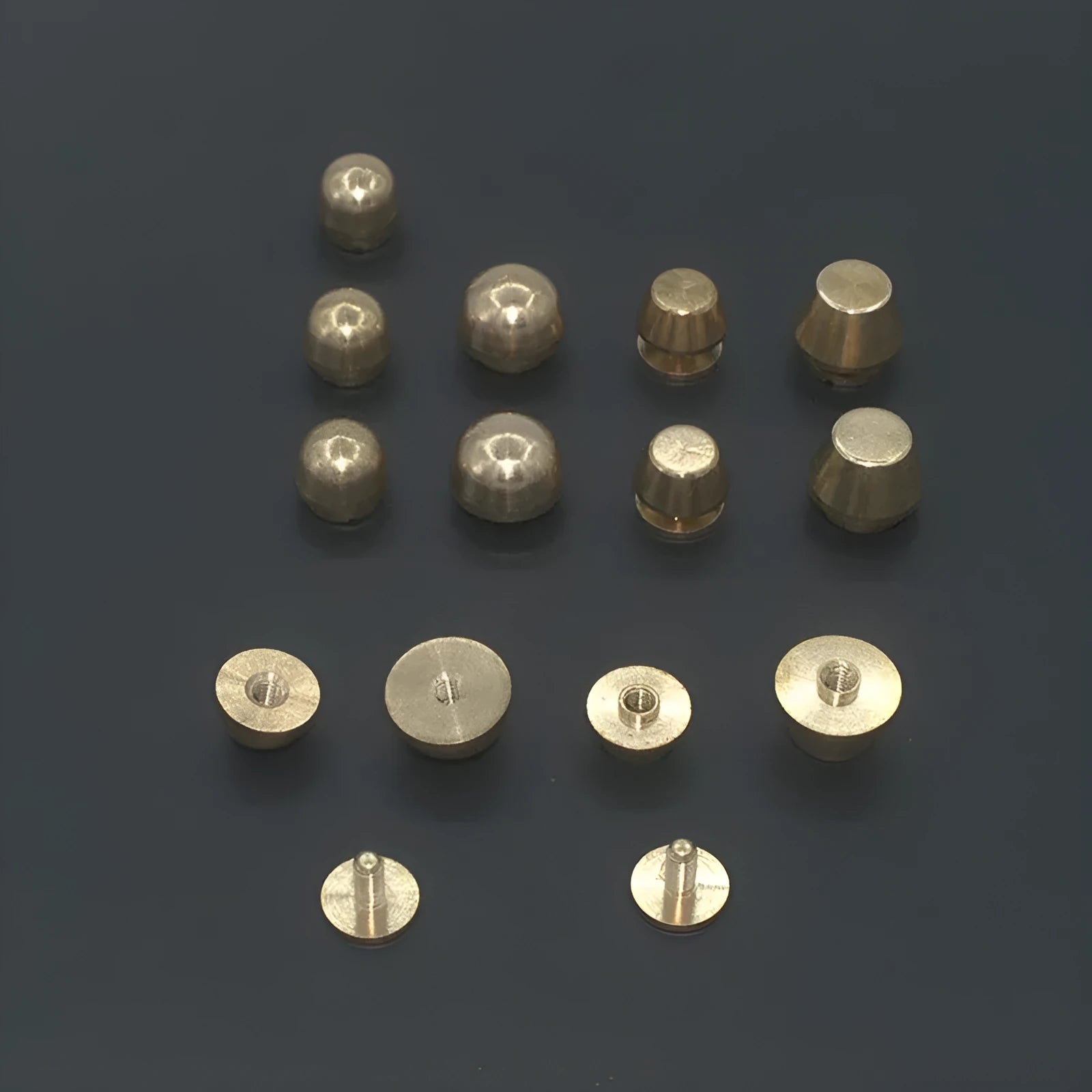 Brass decorative buckle and foot nail jewellery findings in 10x6mm and 12x7mm sizes.