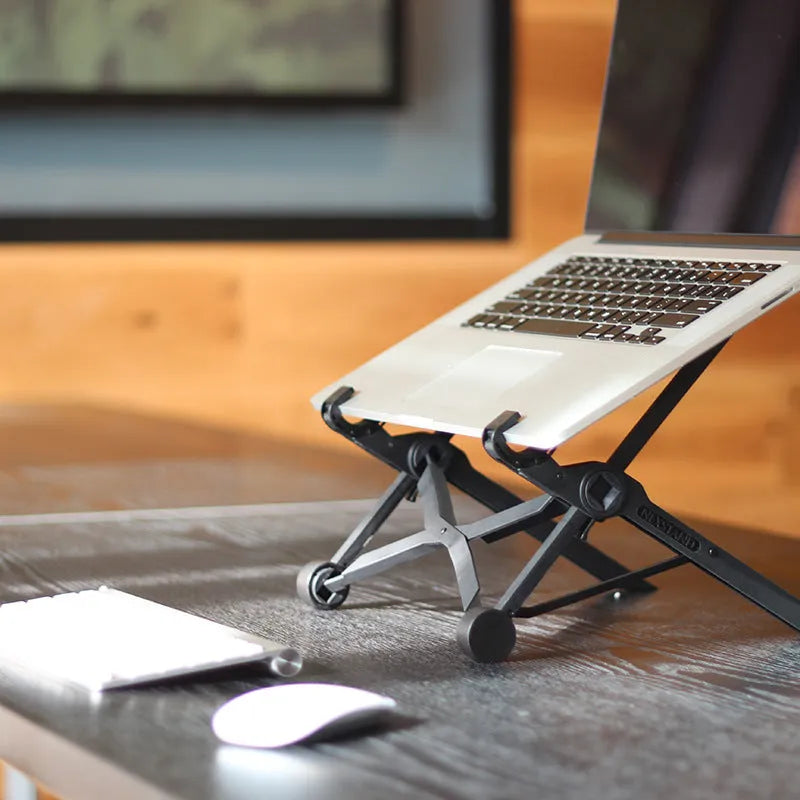 Black folding laptop stand with aluminium frame and reinforced nylon platform in extended position