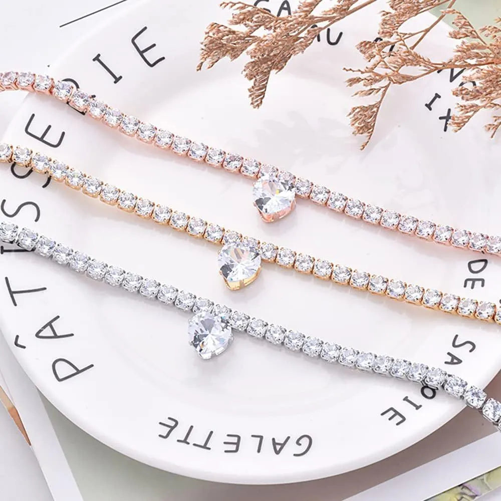 Gold rhinestone heart-shaped decorative collar for cat or dog on a white background.