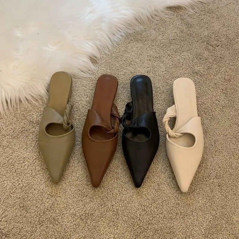 Women's semi-toe box slippers with leather lining and rubber sole in four colour options.