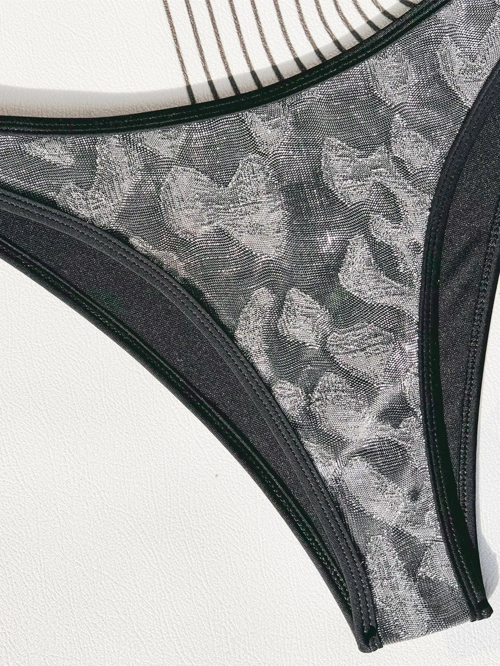 Black ladies bikini swimsuit set made from polyester fabric.