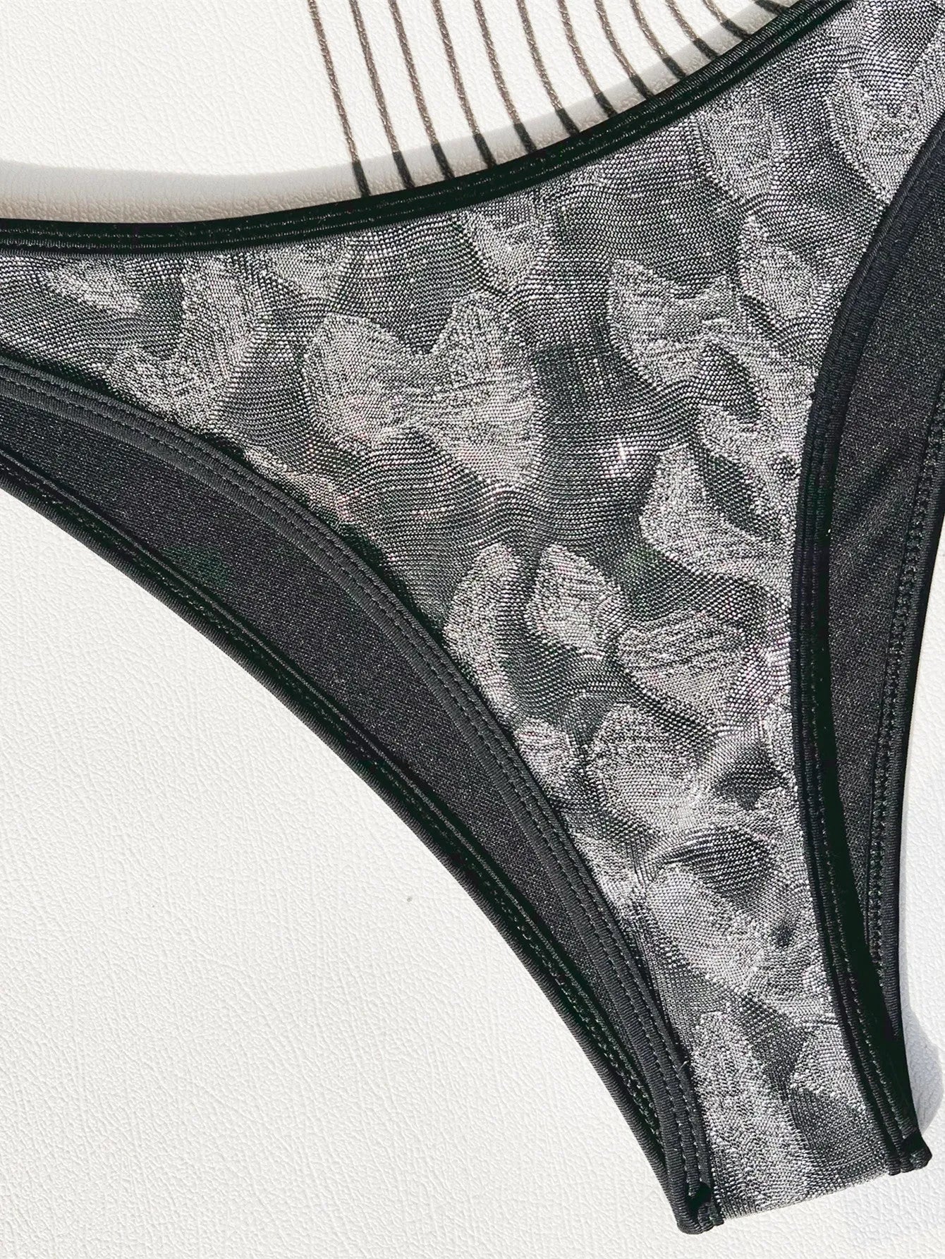 Black ladies bikini swimsuit set made from polyester fabric.