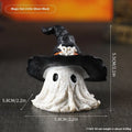 Purple and black resin wizard hat Halloween ghost ornament for holiday decorating.