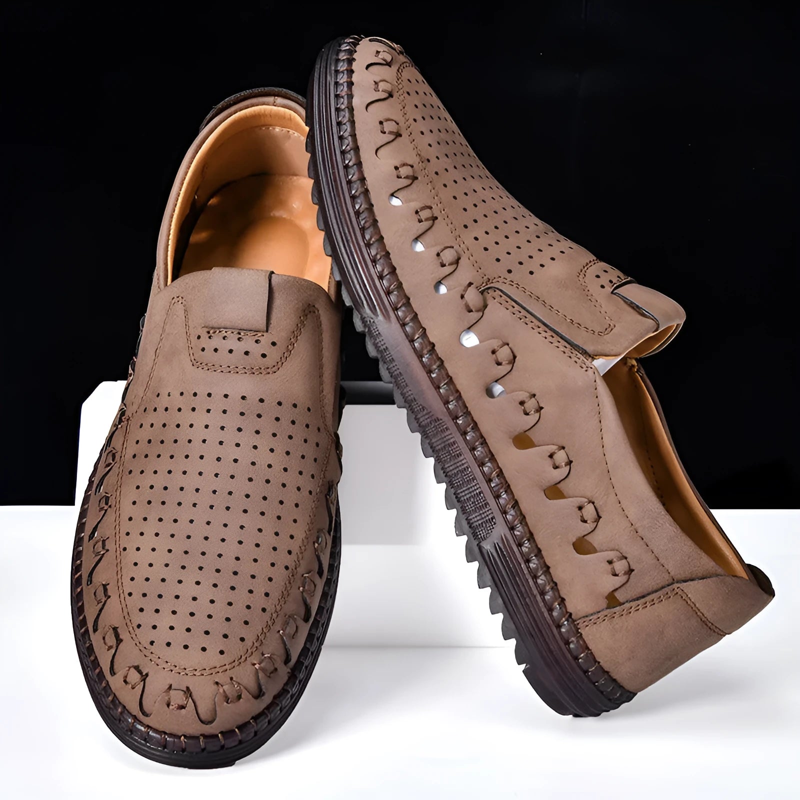 Men's brown slip-on casual leather shoes with a round toe and flat sole.