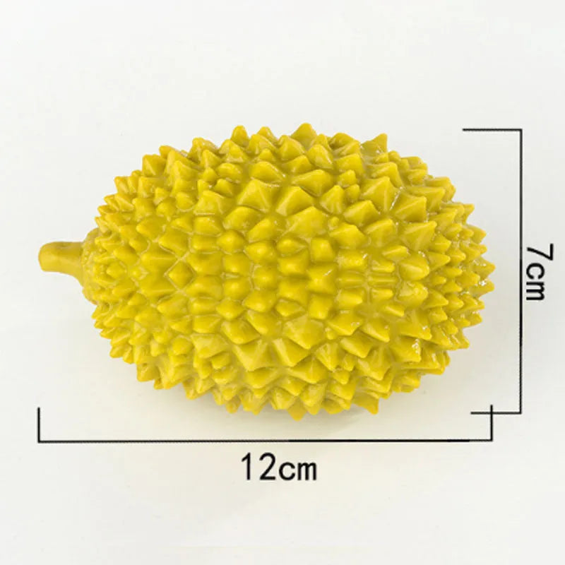 Beige, green, and yellow durian-shaped dog chew toy with textured surface for teeth cleaning