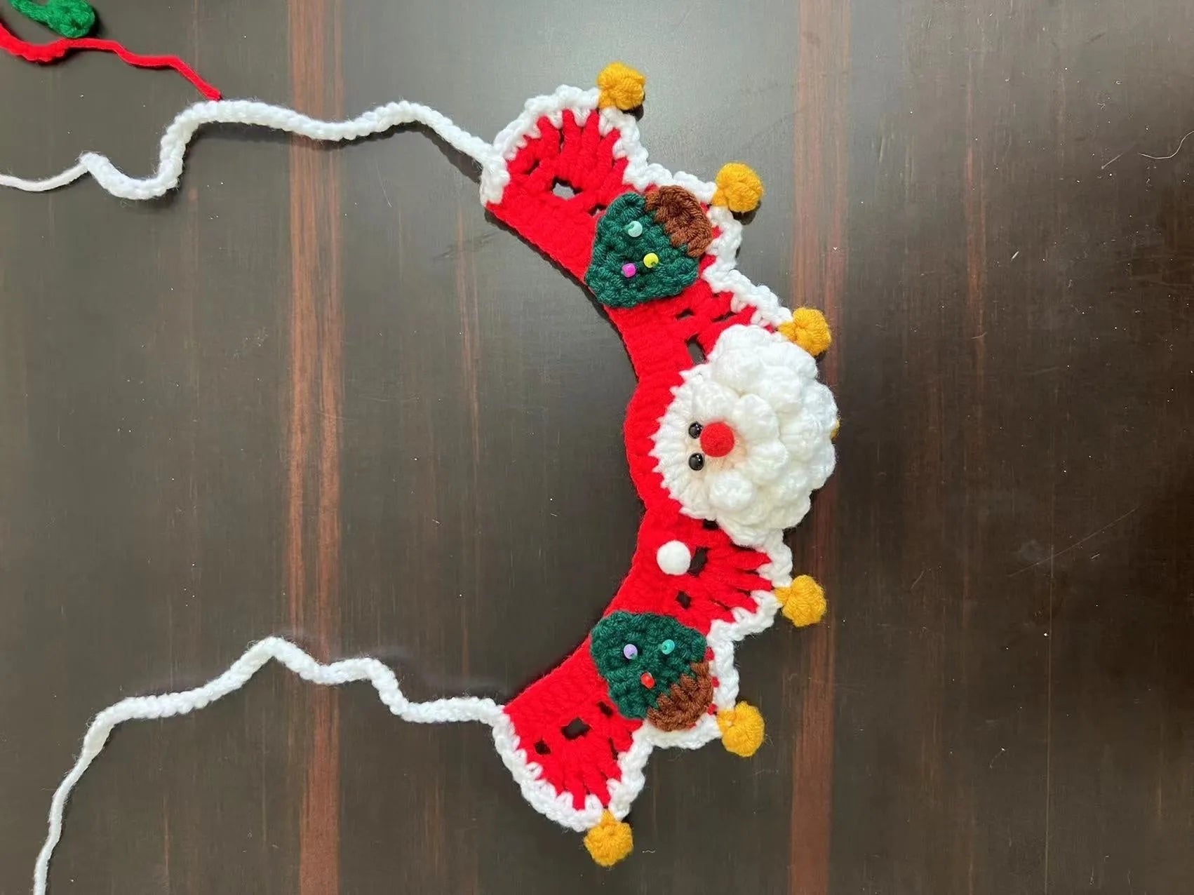 Knitted wool Christmas pet scarf collar in striped Santa Claus design on dog