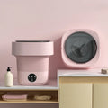 Portable folding washing machine in pine green colour with drain hose and basket