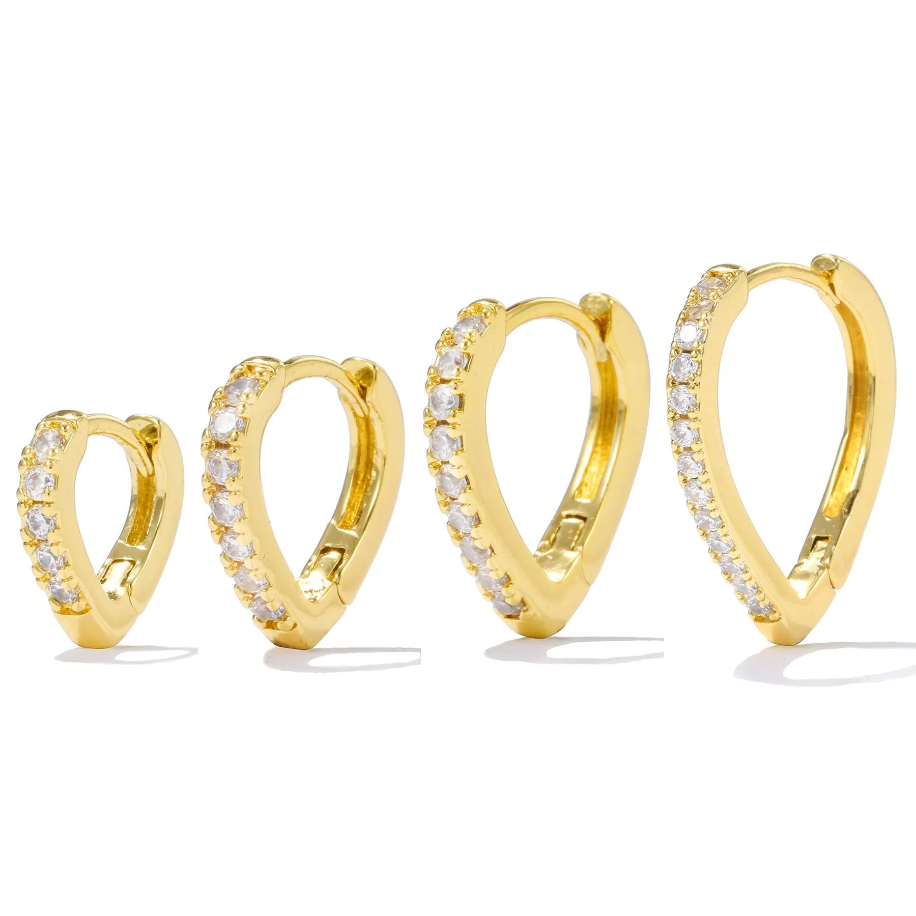 A geometric heart-shaped ear clip in a gold electroplated finish on a copper base.