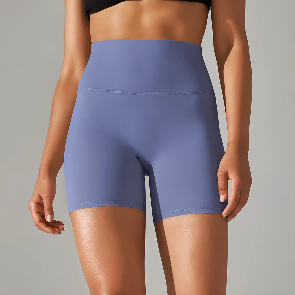 Women's high waist fitness tights in dark green colour with hip lift design for workout and daily wear