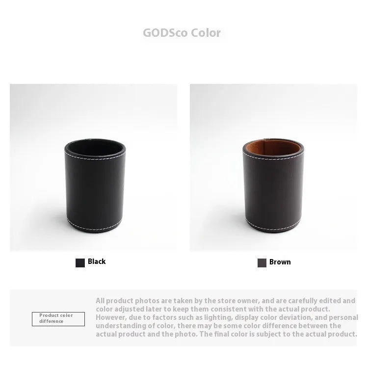 Small round black leather pen holder on a desk