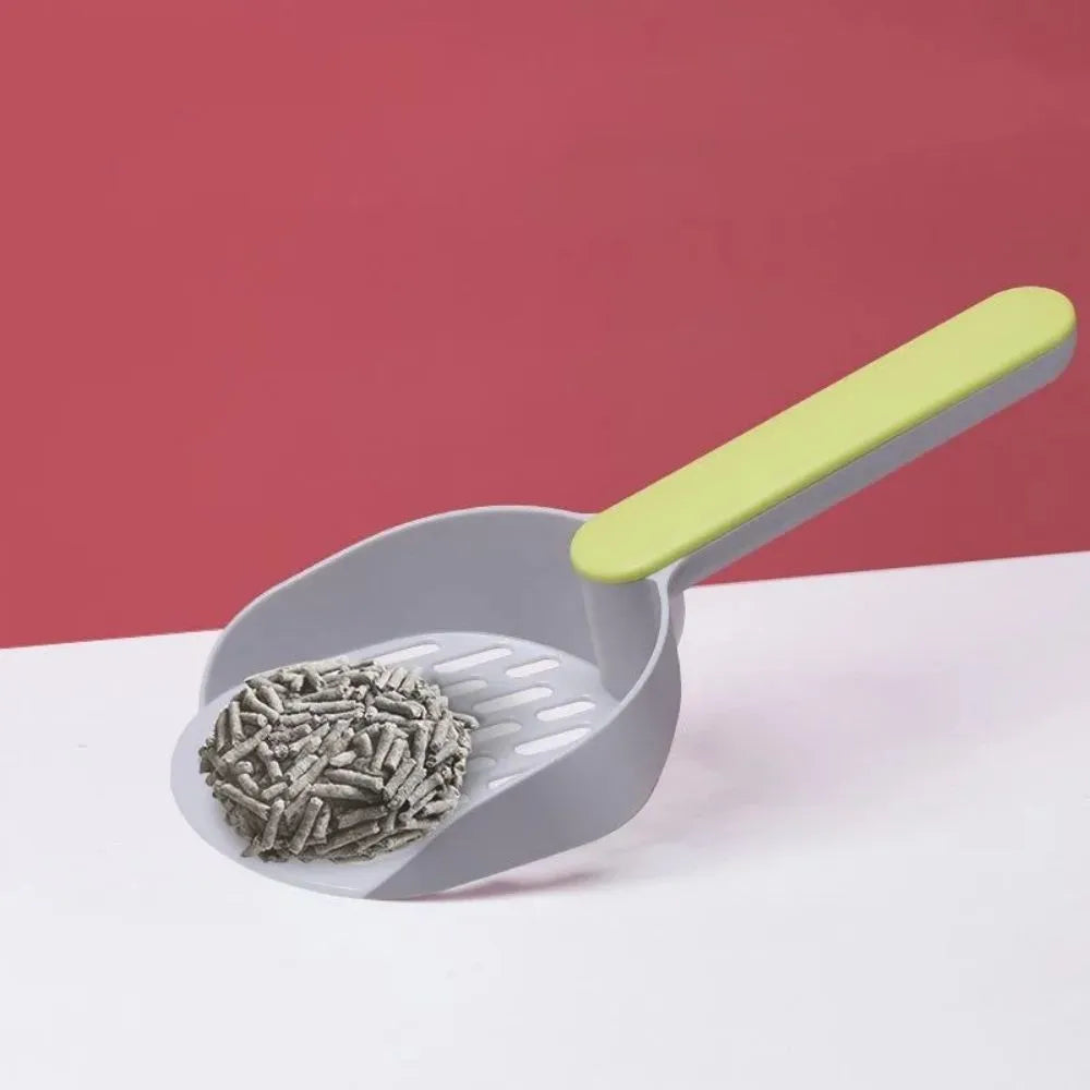 A blue plastic cat litter scoop with sifting holes on a white background.