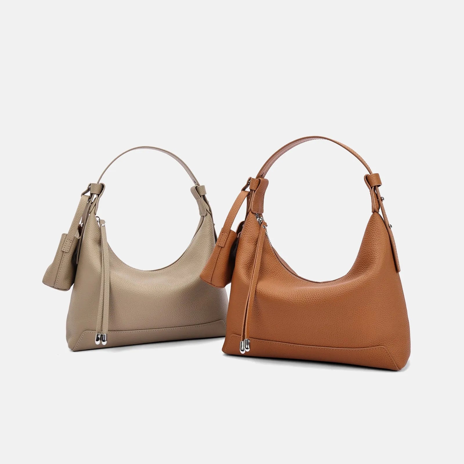 Simple black cowhide leather ladies shoulder bag with visible stitching and urban style design