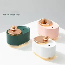 Rotating planet-shaped USB humidifier with night light in green, pink, or white colours.