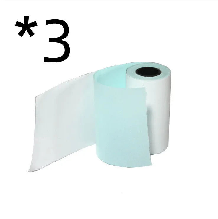 Bluetooth mini thermal photo printer in pink with USB cable and paper rolls on a white background