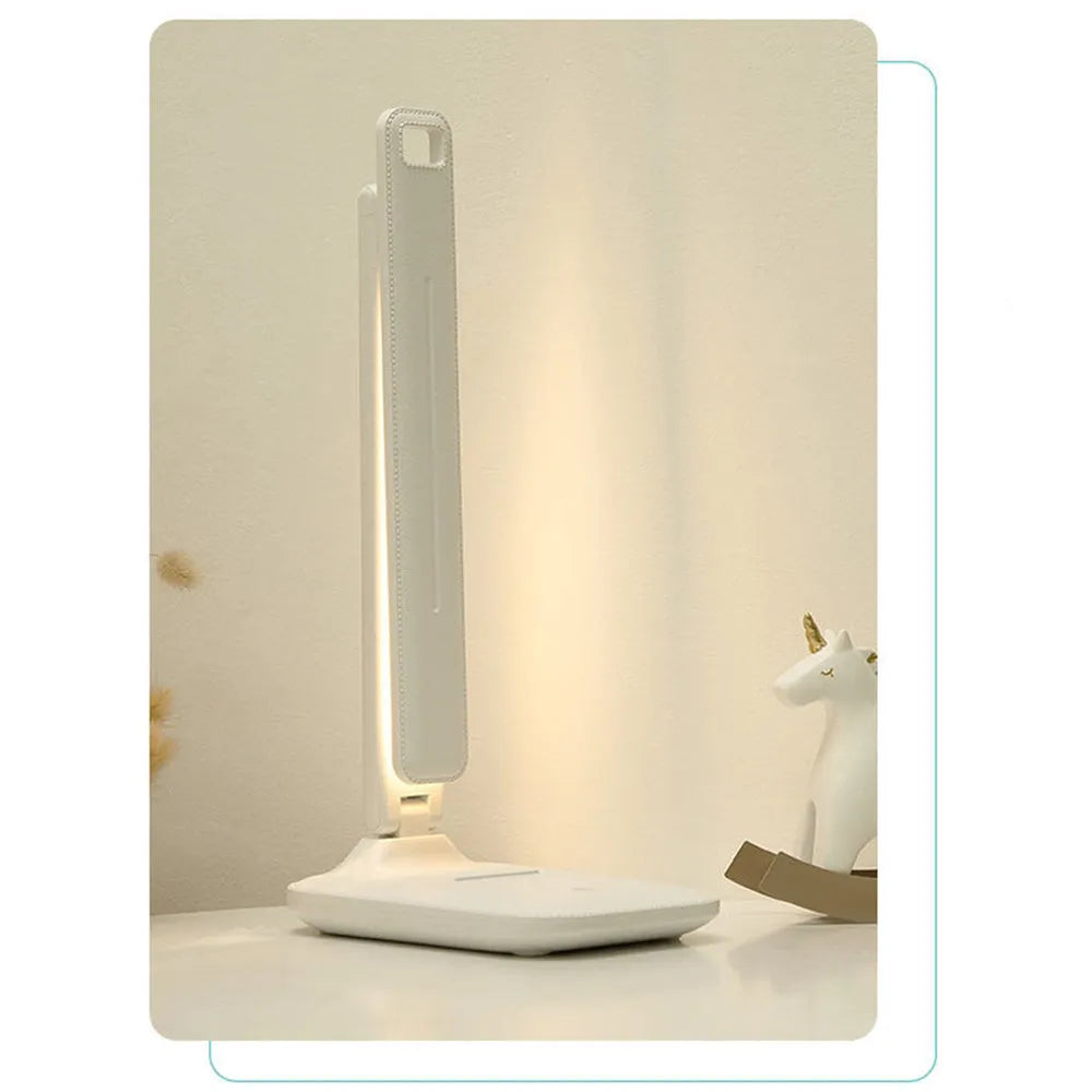White plastic bedside table lamp with touch dimming and USB charging port.