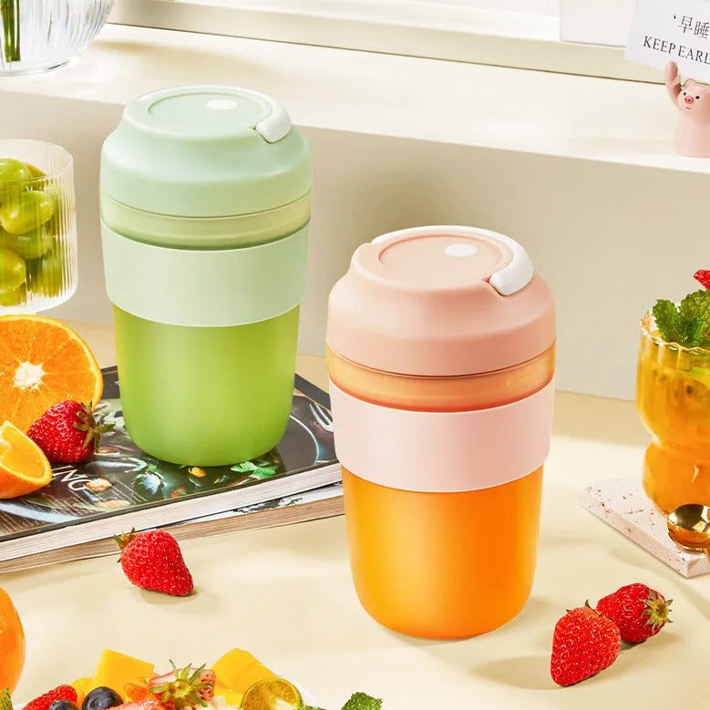 Portable USB rechargeable blender cup in purple, green or orange with 400ml capacity and four stainless steel blades