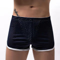 Men's knitted cotton boxer shorts in black, shown flat.