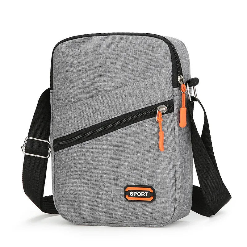 Oxford cloth ultra-light crossbody commuter bag in solid colour with contrasting details.