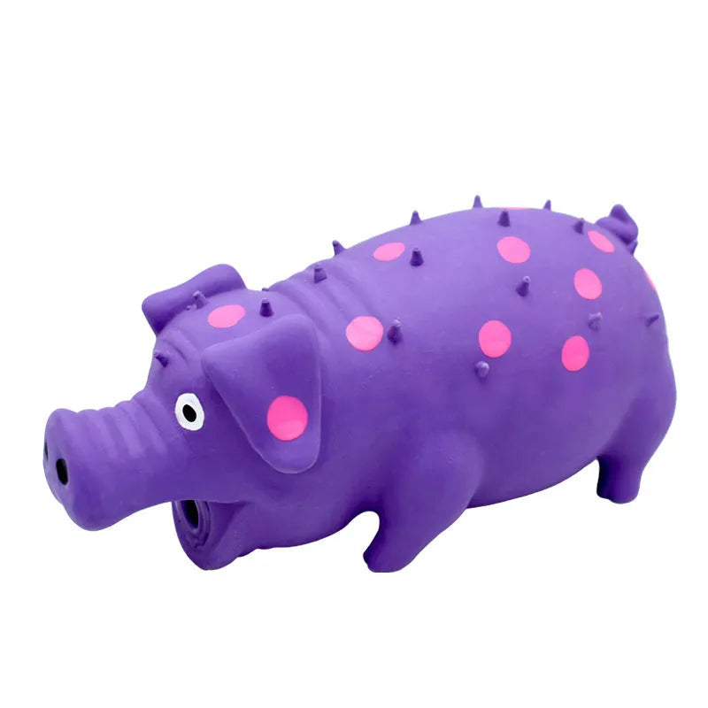 Pig-shaped latex dog chew toy in assorted colours with textured surface for teeth cleaning