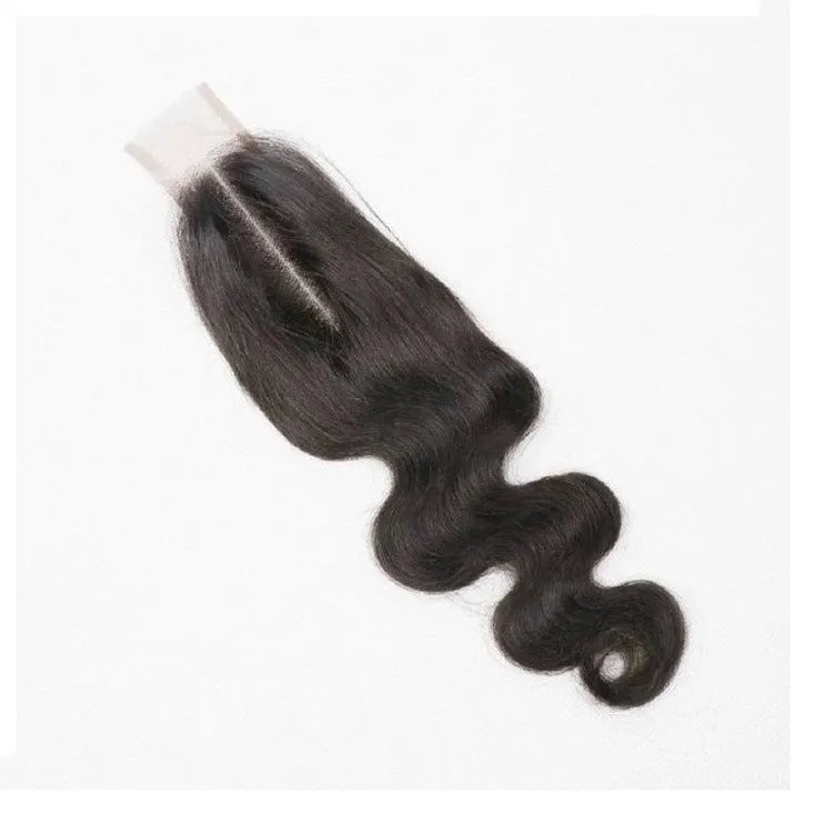 A woman wearing a straight, natural-colour human hair wig in a long length.
