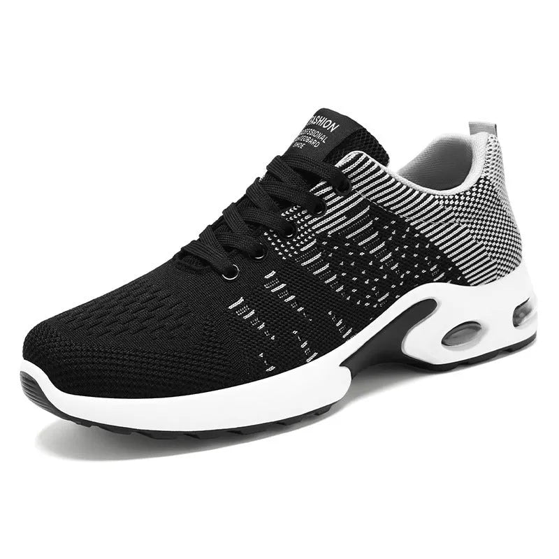 Men's Flyknit mesh low-top casual sneakers in black and grey colourway with lace-up front.