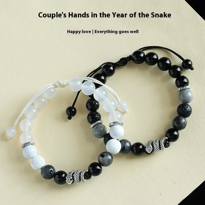 Black and white agate couple bracelets with snake clasps, turquoise accents, and glitter beads