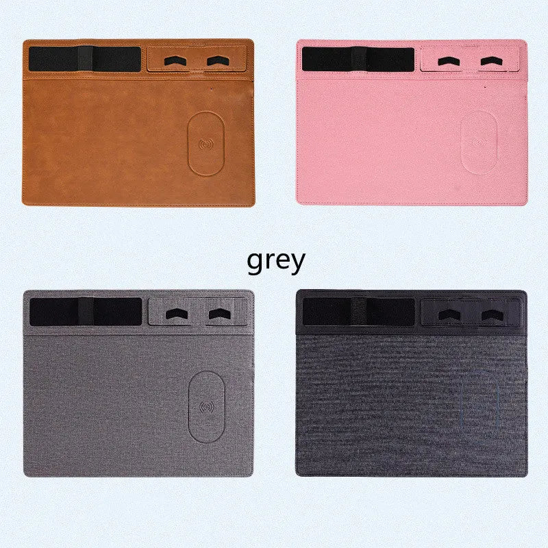 Pink wireless charging mouse pad with mobile phone holder on a desk
