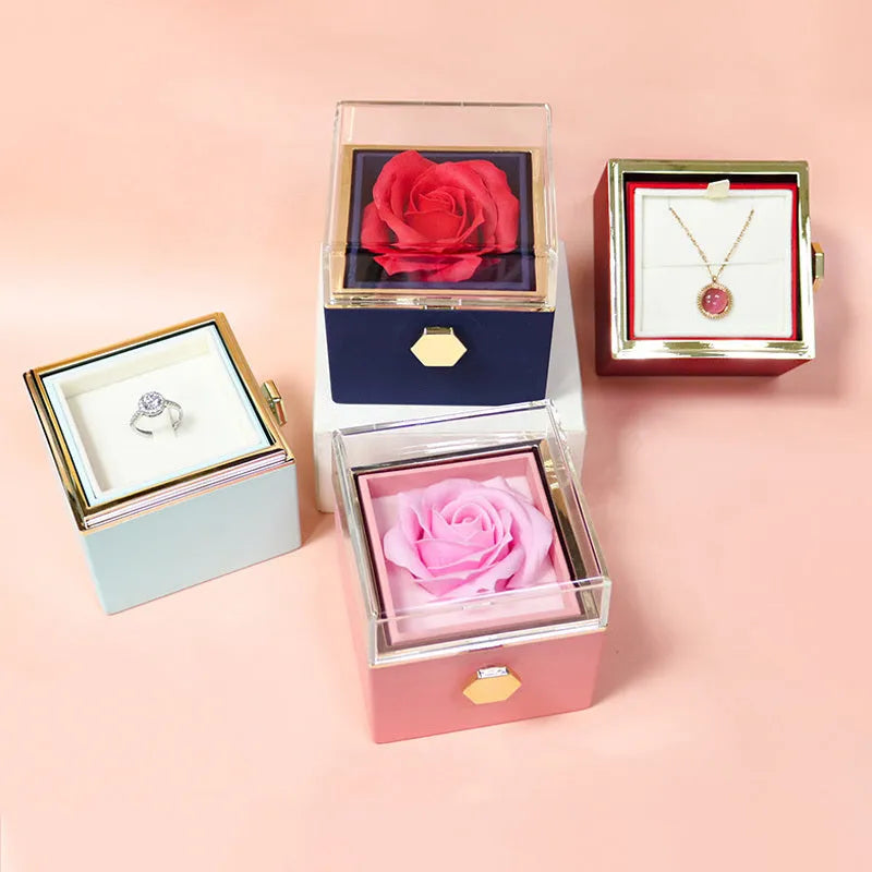 Rotating rose jewellery gift box with preserved real flower under acrylic cover and rotating drawer