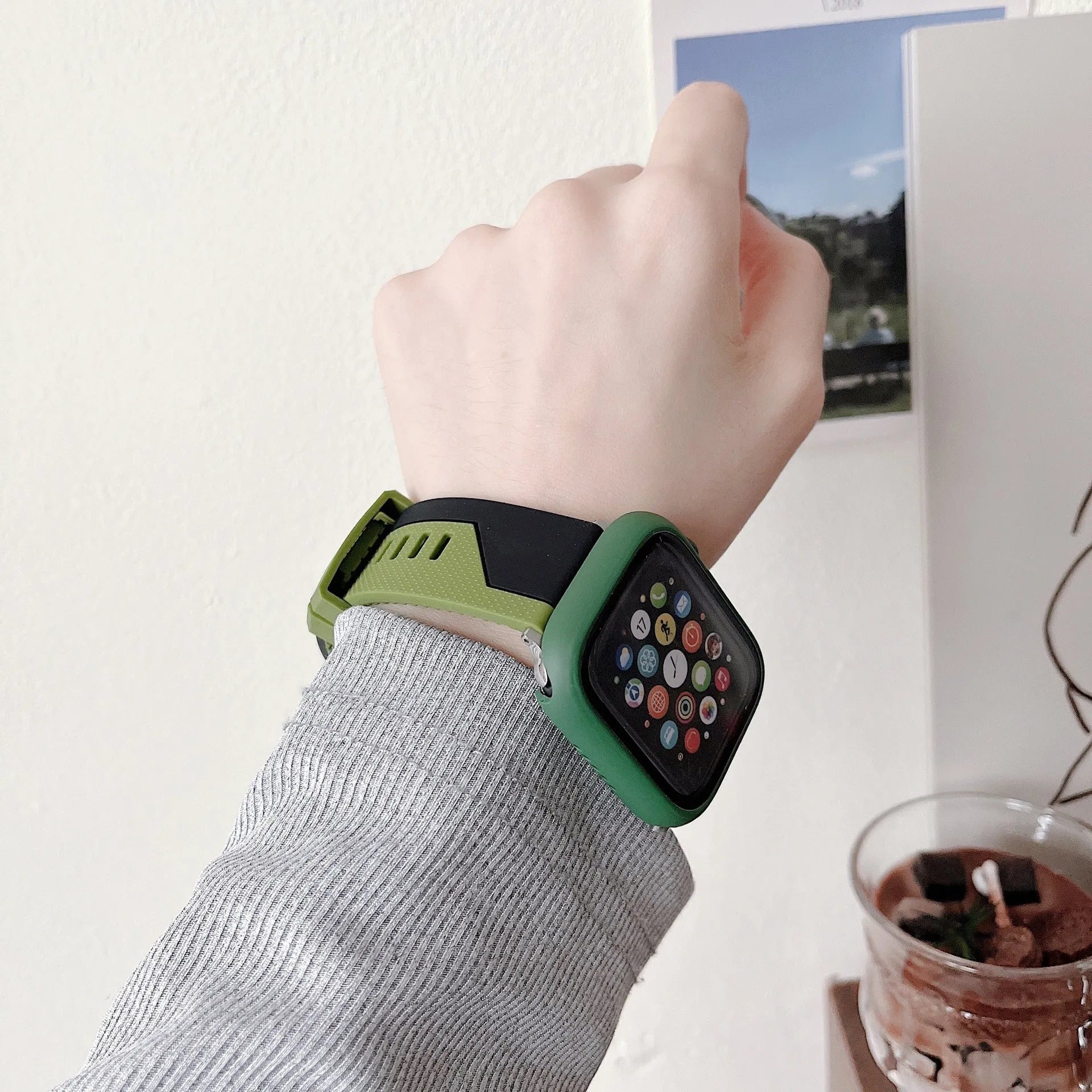 Two-tone silicone protective case for Apple Watch in black and white, fitted on a watch face