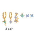 Gold and silver Japanese Korean style stud earrings with blue flower nail shape and zircon mosaic detail.