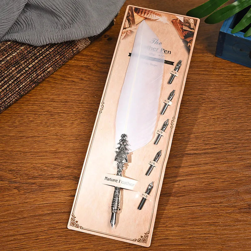 Retro zinc alloy feather dip pen in choice of ten colours on a desk.